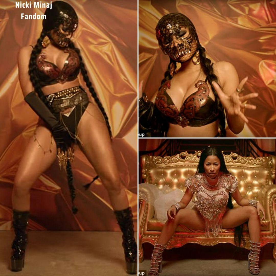 Cover Image for Naughty Nicki! Ms Minaj wears lace mask and snake-themed leather bikini to star in Light My Body Up music video.
